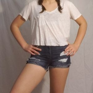 A white hand cropped top